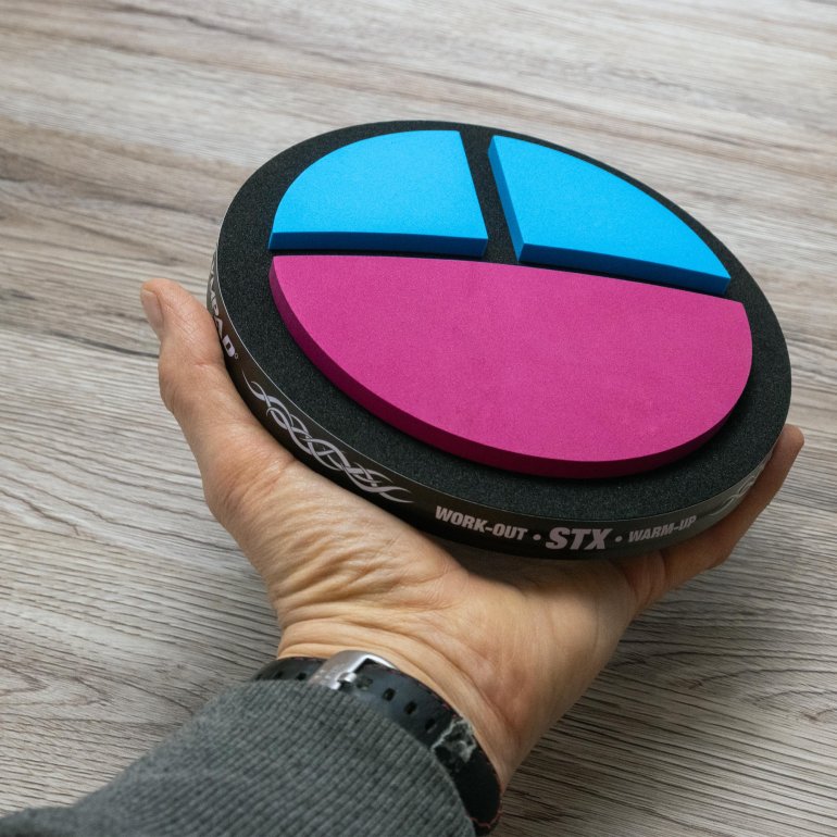 STX pad hold by hand